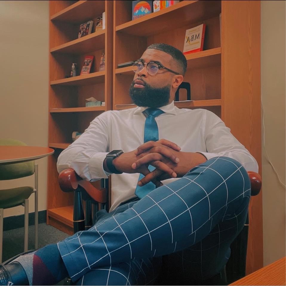 Bernard sitting and is dress professional